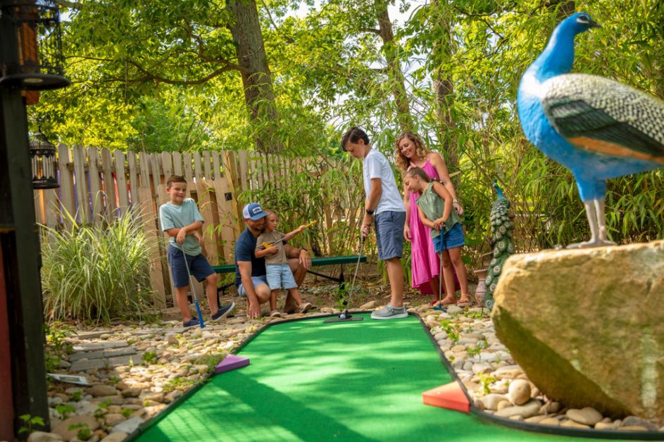 Family playing putt putt