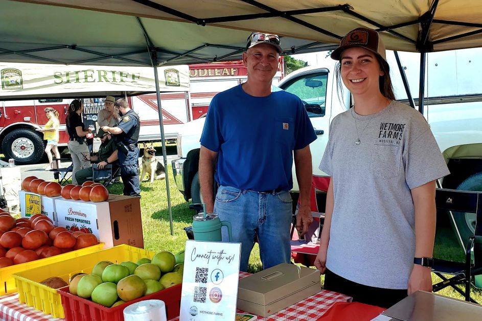 Two people at produce tent