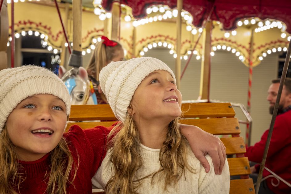 Girl Looking up at Lights on Carousel