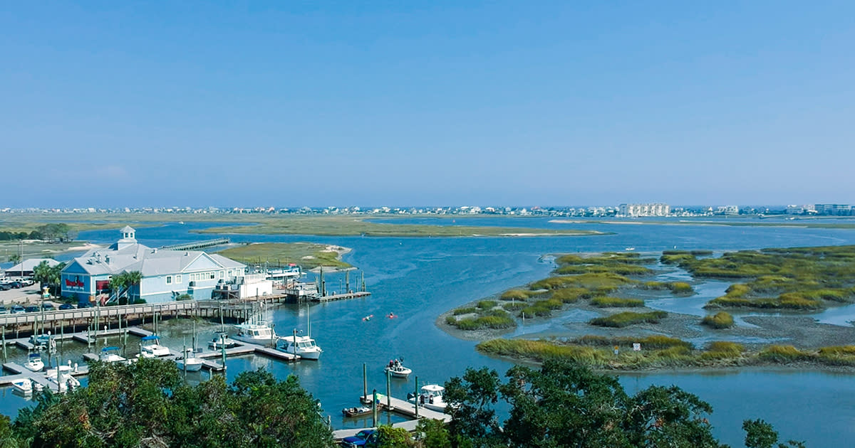 Aerial of Murrells Inlet with marsh, marina and beach homes