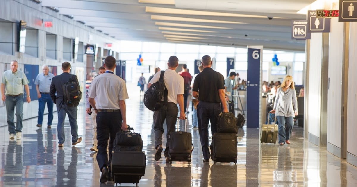 Pilots and travelers make their way through the terminal of Dwight D. Eisenhower National Airport in Wichita