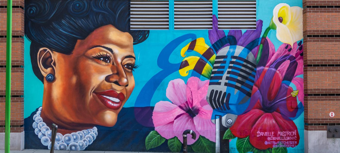 A brightly painted mural of Ella Fitzgerald adorns a wall in Yonkers.