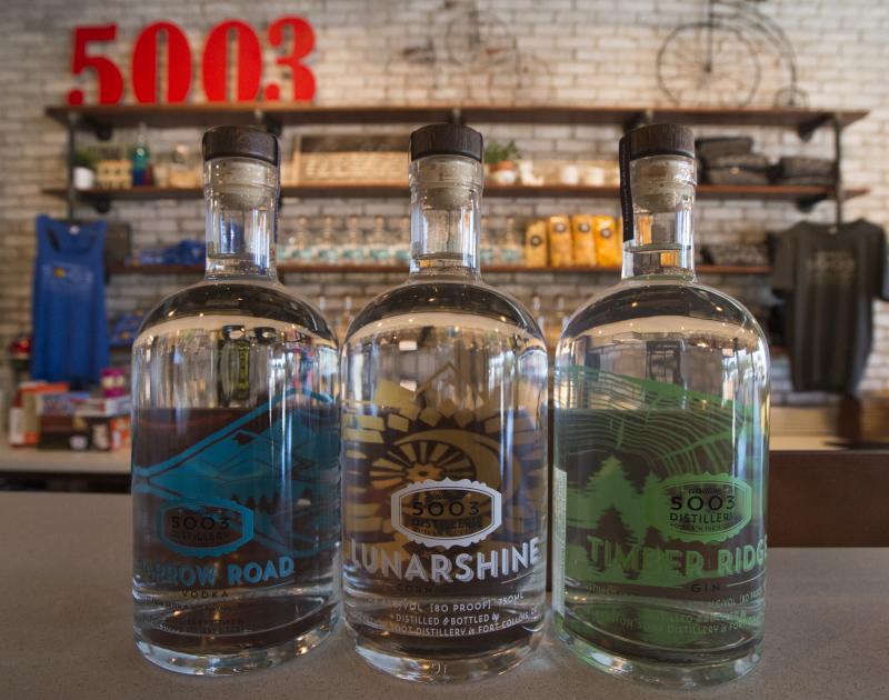 a row of bottles from 5003 distillery