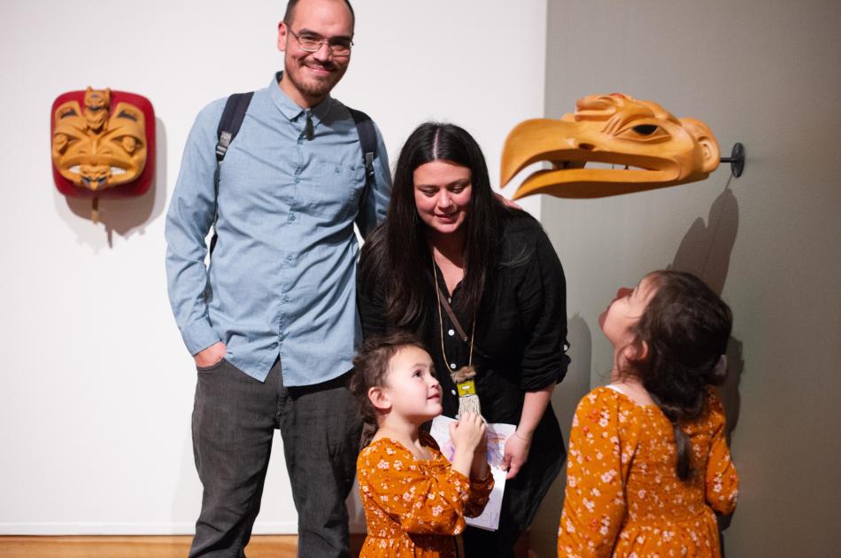 A family explores an exhibition together