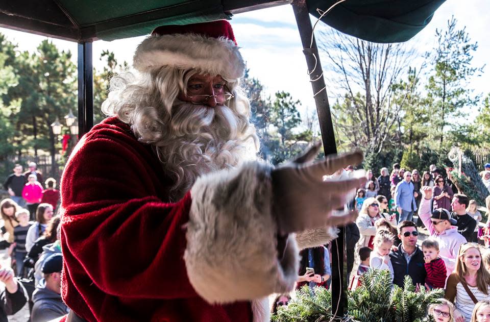 Santa Claus greets guests during a holiday event in Wichita