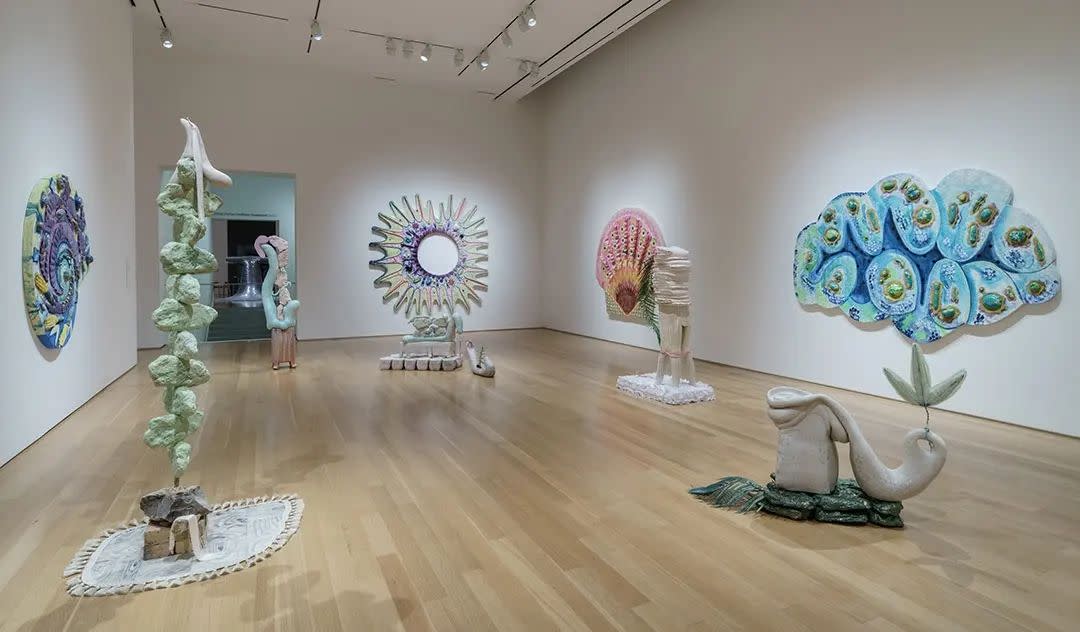 A gallery of freestanding modern art sculptures in various colors and shapes.
