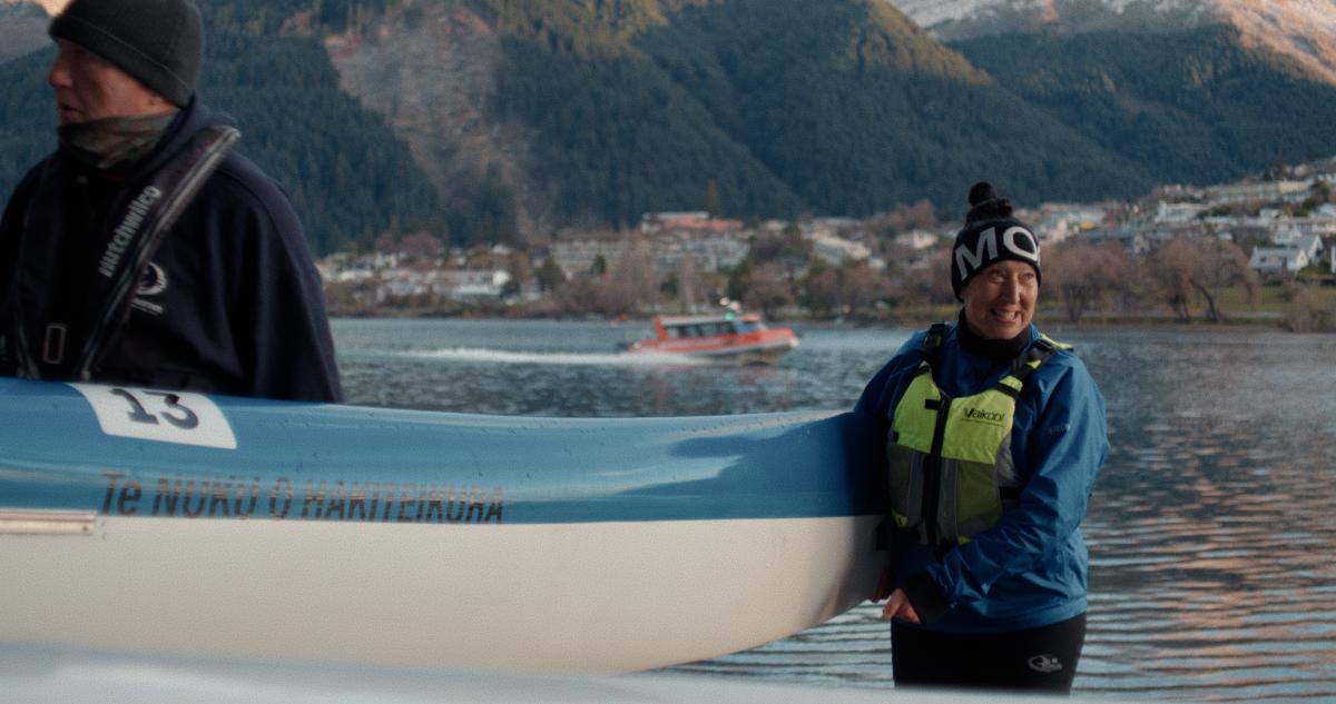 Frances - Waka Ama holding a canoe