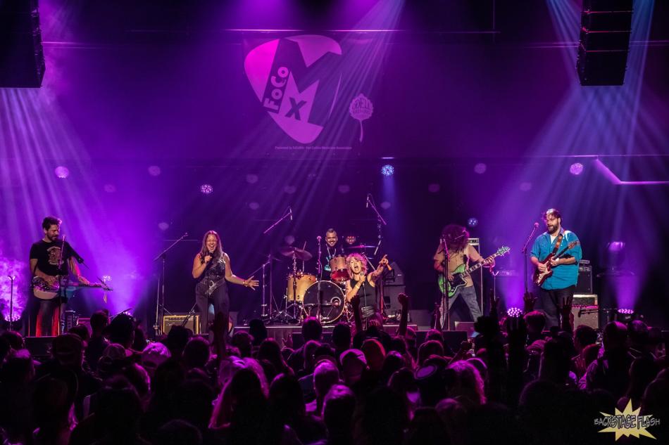 A band up on stage rocking.