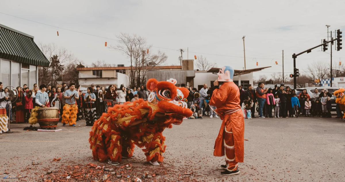 Two people perform in costumes during a Lunar New Year celebration in Wichita