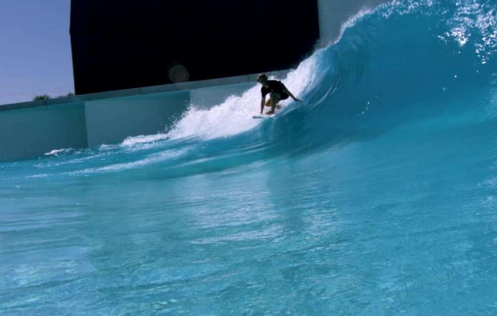 A surfer at the wave pool at Palm Springs Surf Club