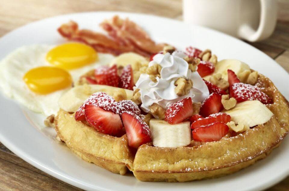 Epic Egg's Strawberry & Banana Waffle with eggs, a fun breakfast in Cheyenne.