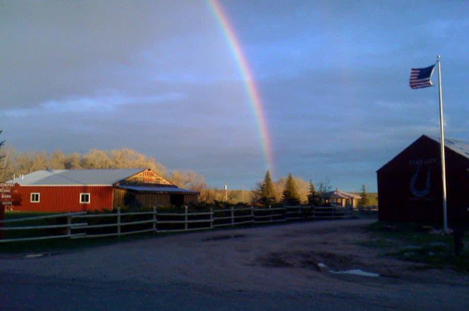 A rainbow stretches above Terry Bison Ranch, a great place for RV camping for families.