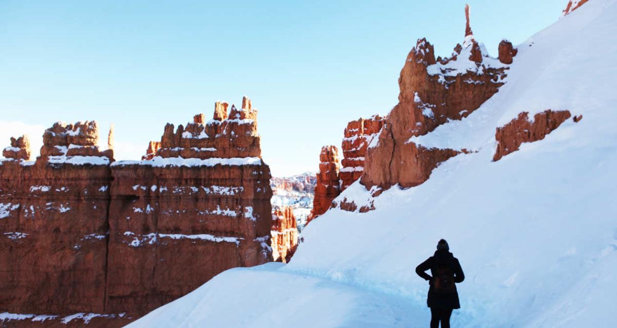 Hiker in the snow in Bryce Canyon National Park