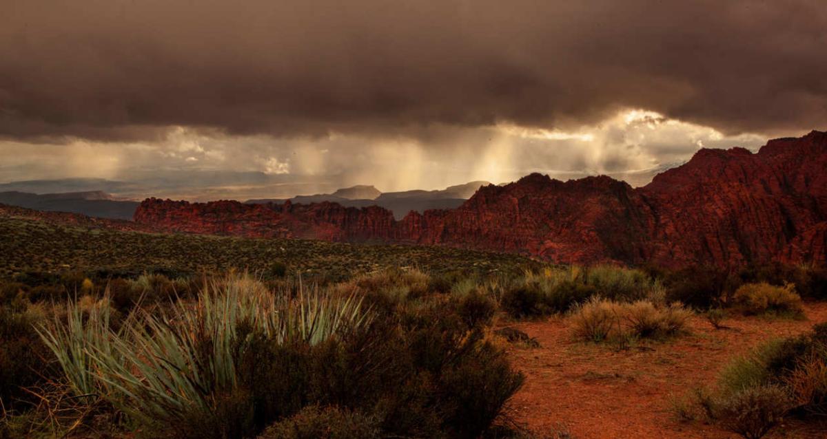 Rain clouds dropping rain over Snow Canyon State Park