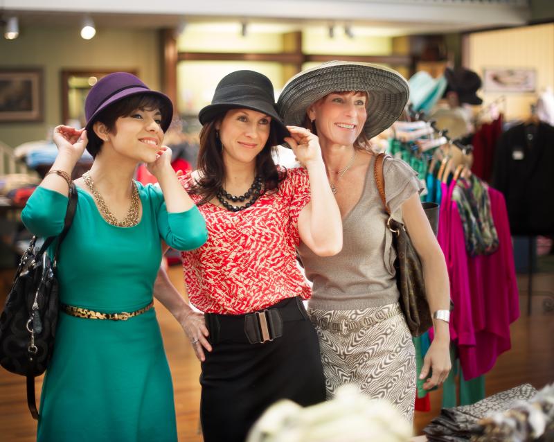 Women Try On Hats at Boutique Store In Fredericksburg, TX