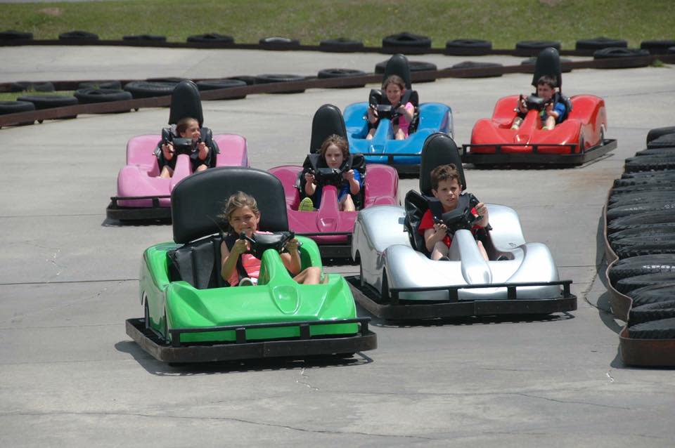 Kids go-karting at Kart Ranch in different colored karts