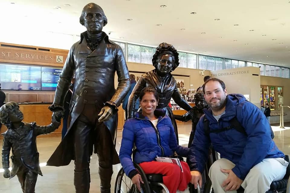 Wheelchair users in front of Washington Family statues at Welcome Center at Mount Vernon