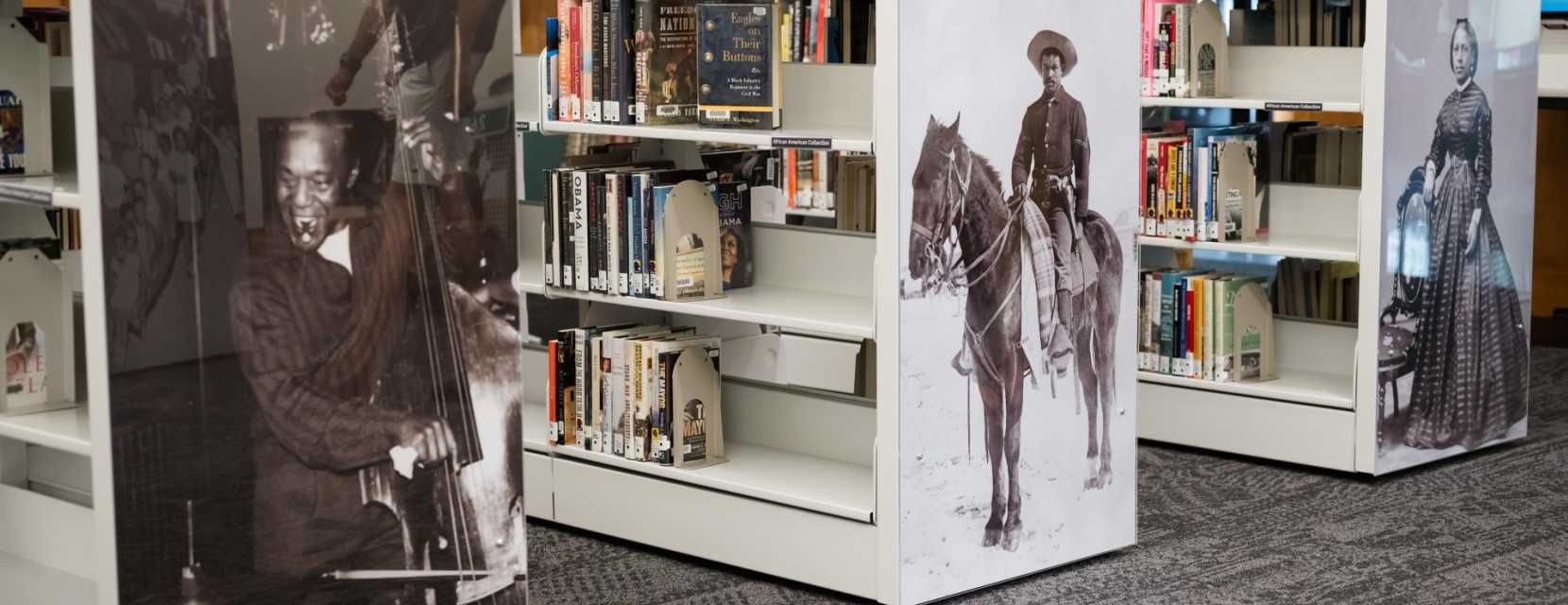 Bookshelves feature historical people at Blair-Caldwell African American Research Library