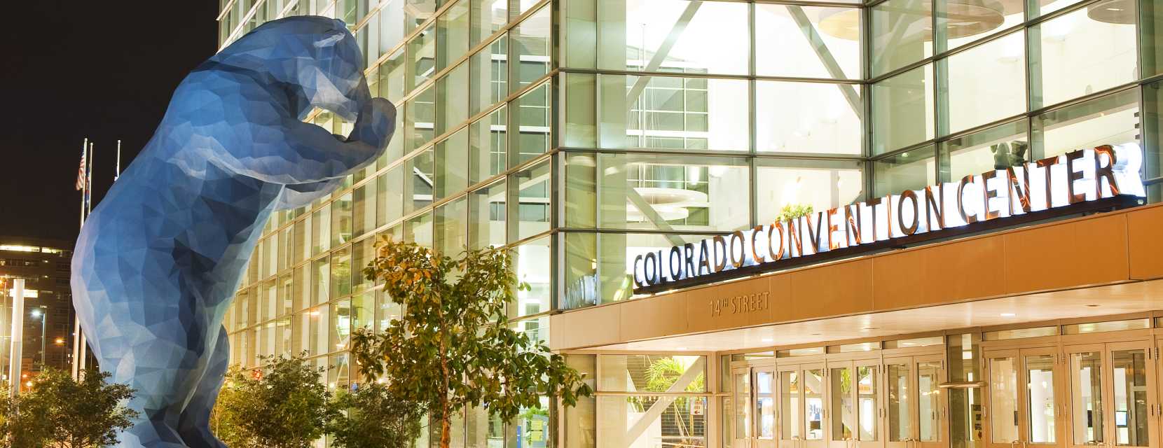 The famous Blue Bear sculpture looks into the Colorado Convention Center.