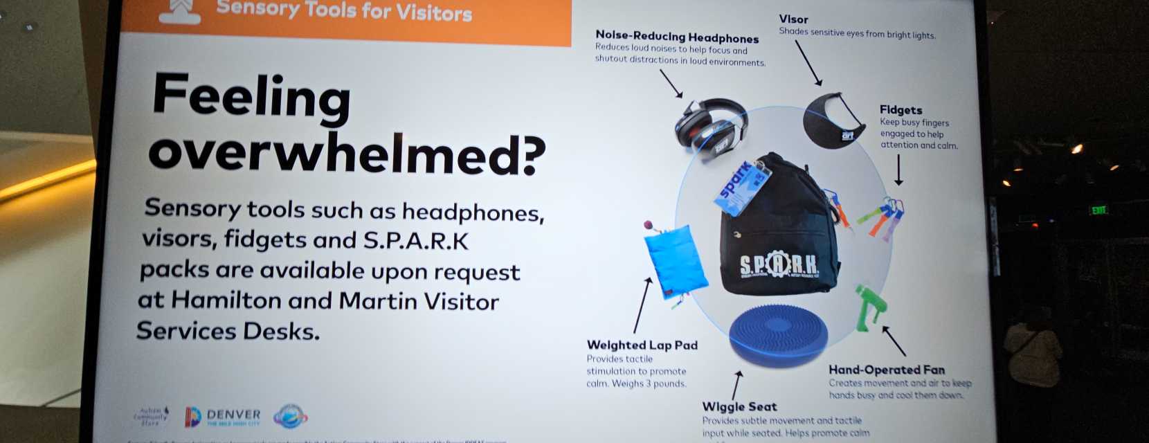 A digital screen mentioning sensory tools for visitors to Denver Art Museum