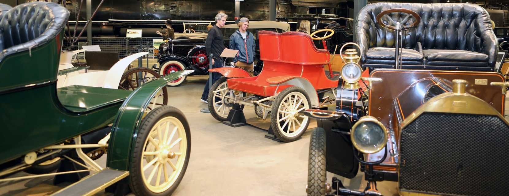 Two visitors check out classic cars at the Forney Museum of Transportation in Denver, Colorado.
