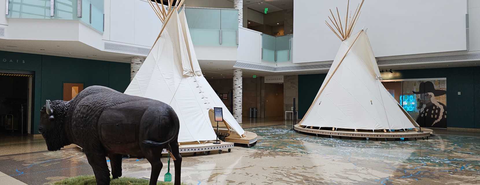 An artificial bison and two teepees at History Colorado Center