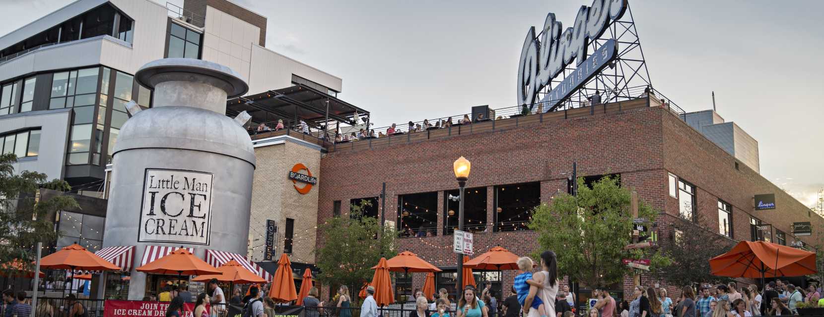 A large crowd gathers around Little Man Ice Cream in Denver, Colorado.