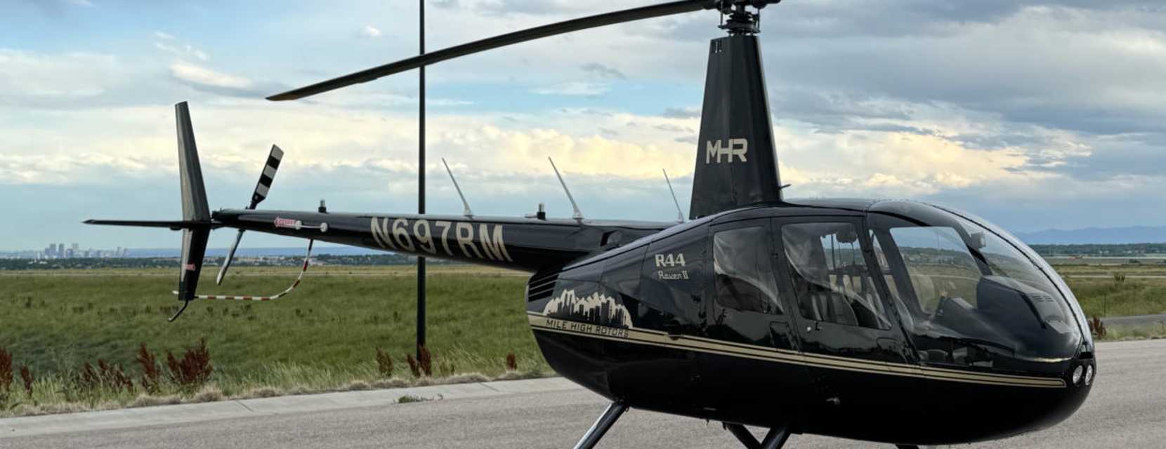 A Mile High Rotors helicopter sitting on the ground in Denver, Colorado