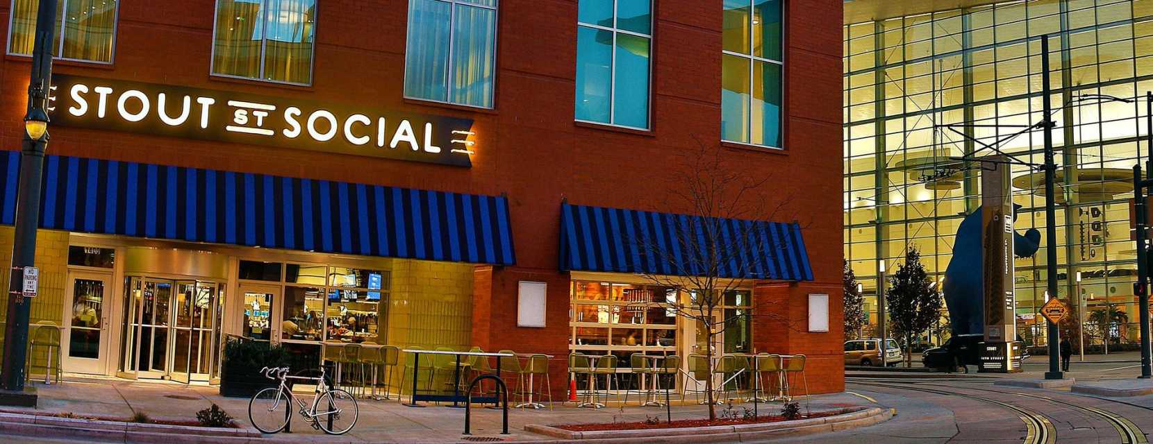 Exterior of Stout St. Social with the Blue Bear statue in the background