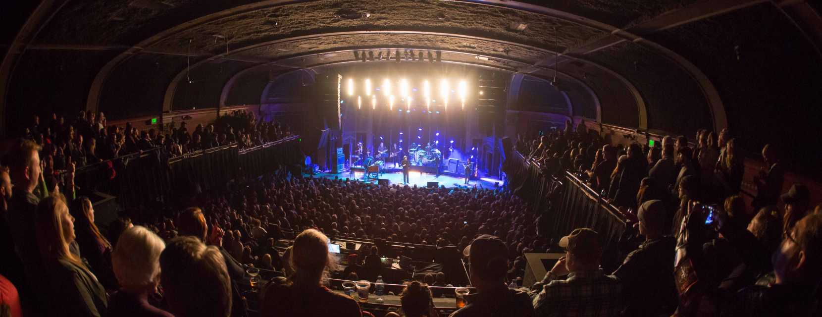 A crowd enjoys a live concert inside the Ogden Theatre in Denver, Colorado