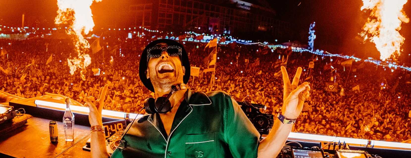 DJ Fisher performs in front of a crowd.