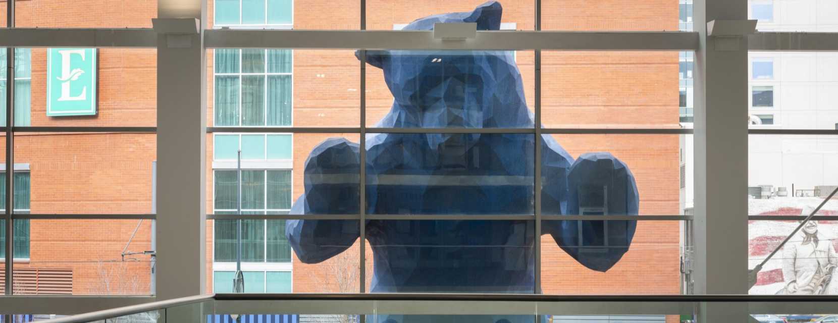 View of the Blue Bear statue in Denver from the interior of the Colorado Convention Center