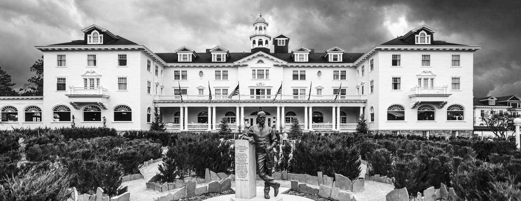 The Stanley Hotel in Estes Park, a massive historic building with a statue in front