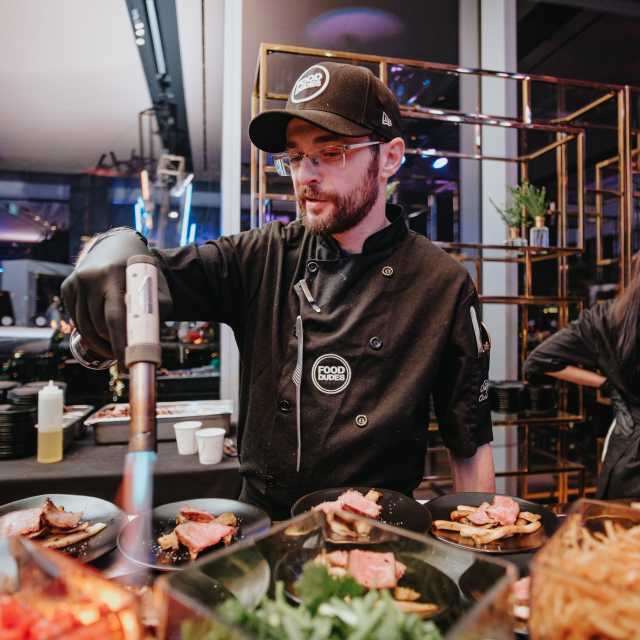 The Food Dudes staff doing food prep at an event