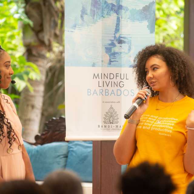 Ace west and Monique billings chatting outside during Mindful Living Barbados2019