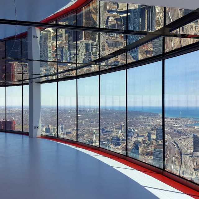 Floor to ceiling windows at the CN Tower showing the Toronto city skyline