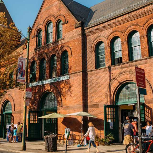 Exterior shot of Central Market House in autumn with people walking along the sidewalk