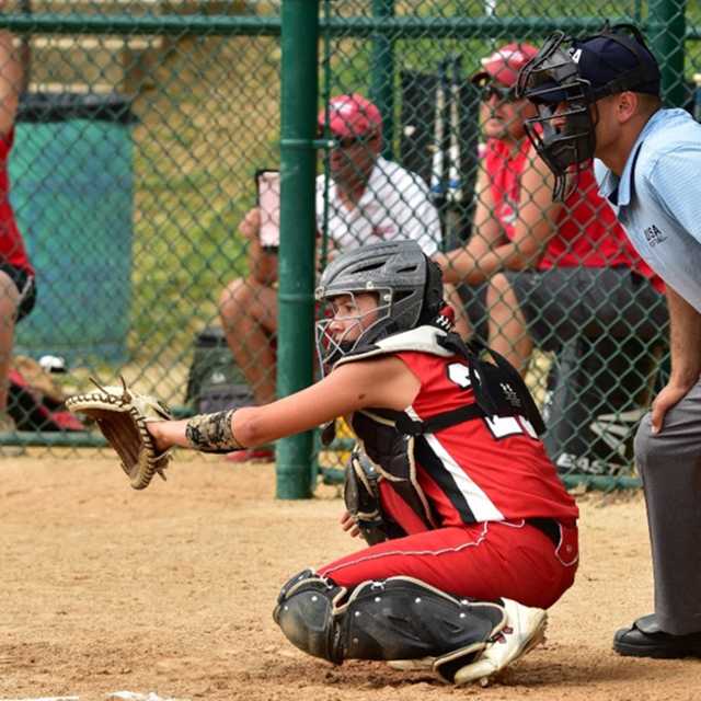 photo of girl\'s softball catcher and a batter during a game