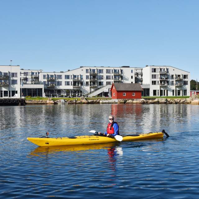 Woman kayaking at Lindesnes Havhotell