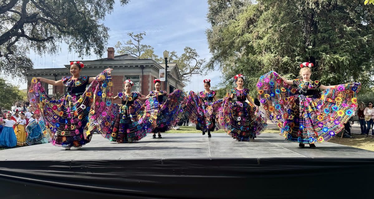Dia De Los Muertos dancers dancing in the street