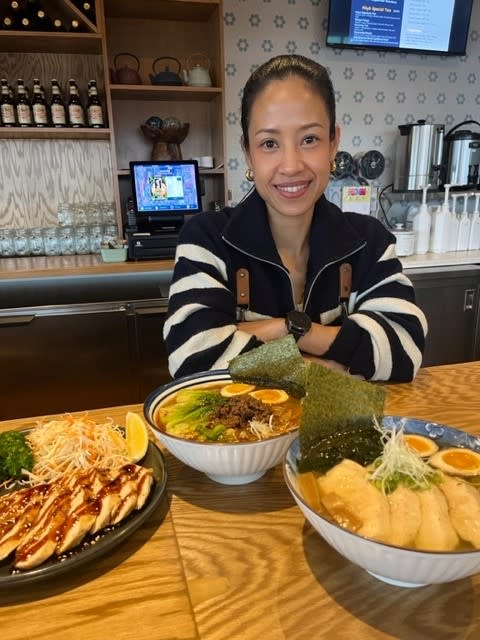 Owner of Koyo Ramen pictured with plated food