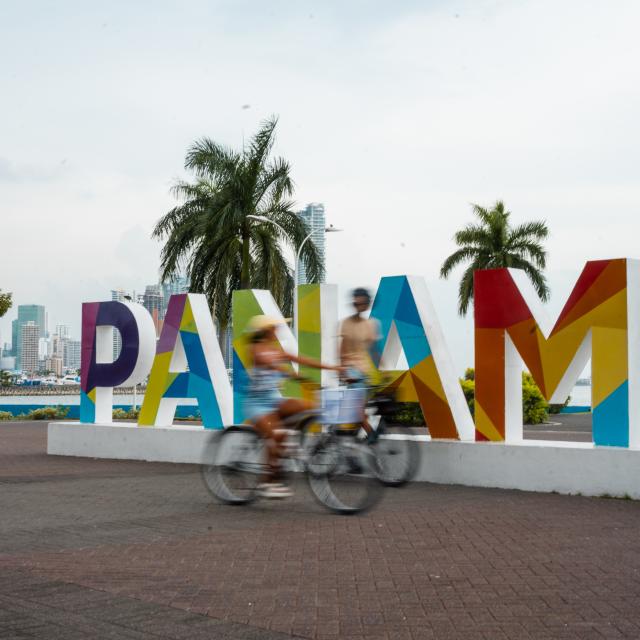 Biking on Cinta Costera, in the background Panama City skyline, Panamá