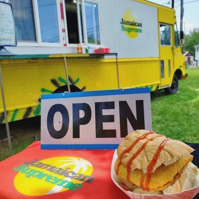 Jamaican Supreme Food Truck parked on the grass