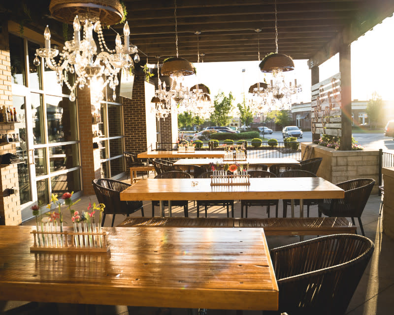 outdoor tables with fancy chandeliers