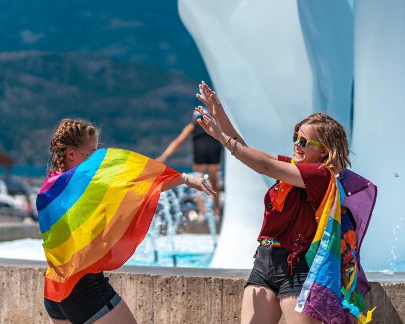 People with pride flags at Sails in Kelowna