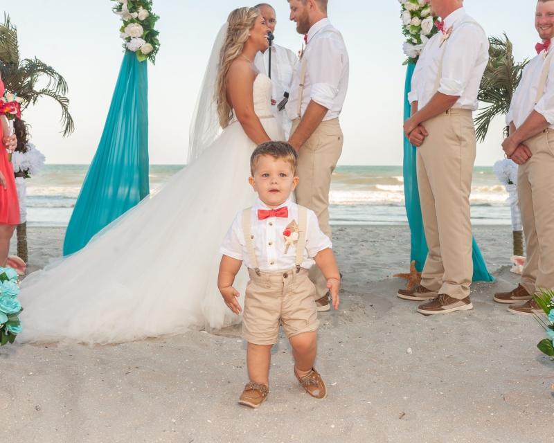 Little boy photo bombs wedding couple as pronounced Mr. and Mrs.