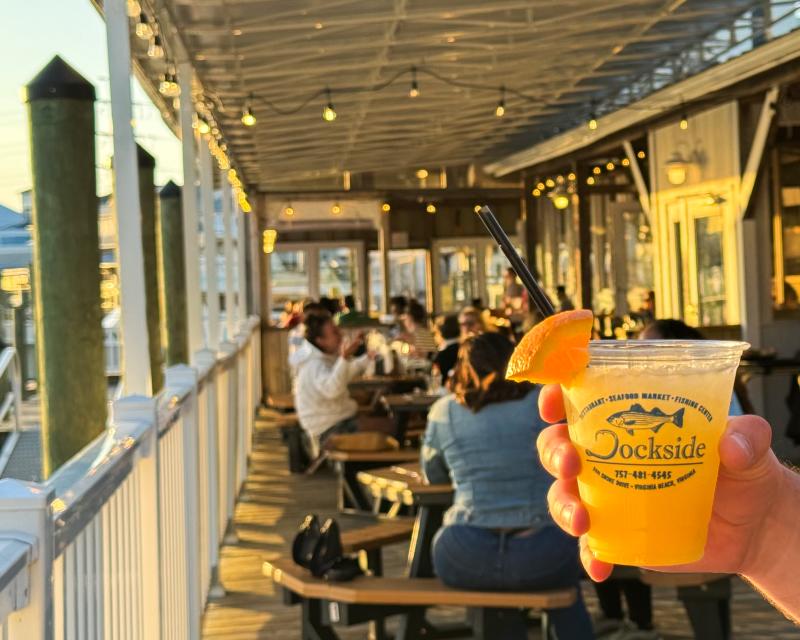 person holding orange crush at Dockside restaurant and marina on the lynnhaven bay