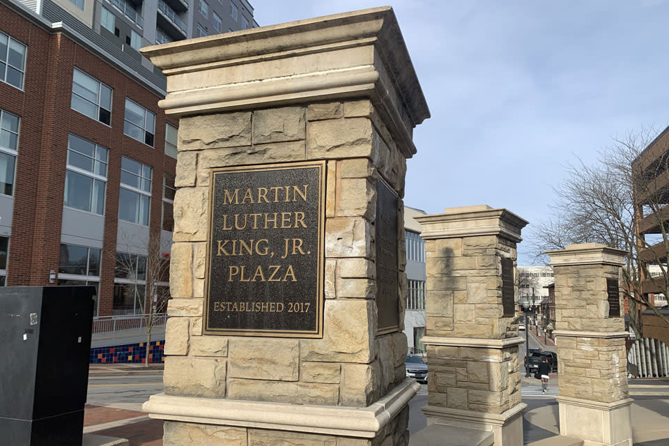 A stone monument in front of a building
