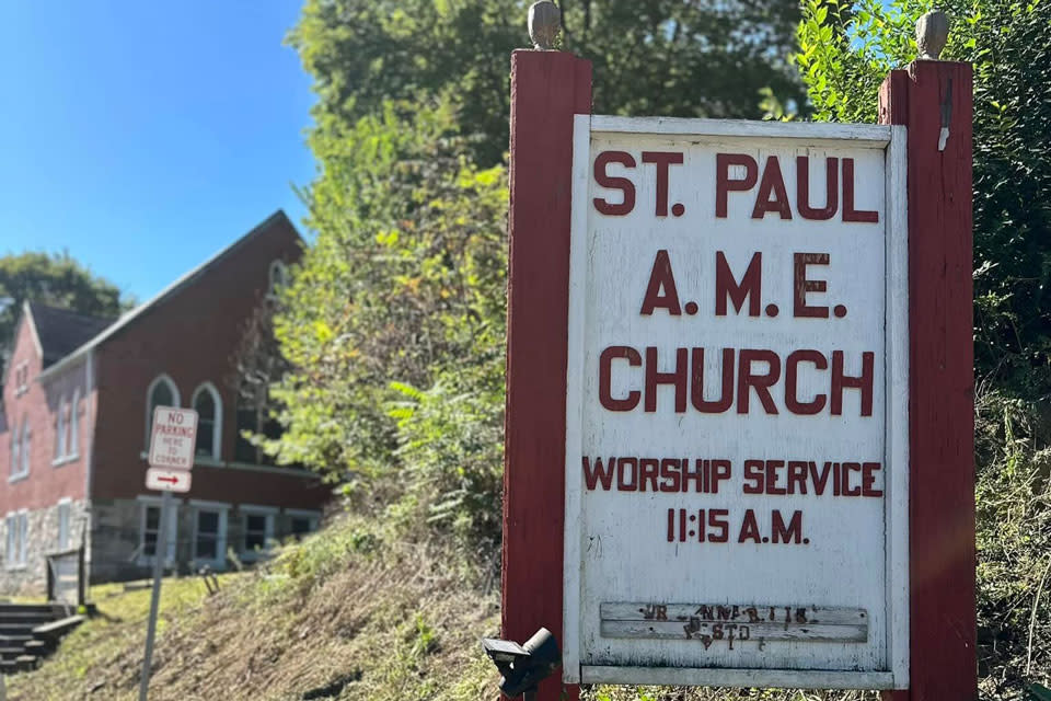 Church Building in the back with signage board