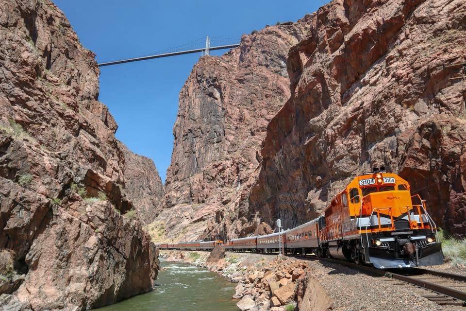 Royal Gorge Railroad With Train Passing Under A Bridge